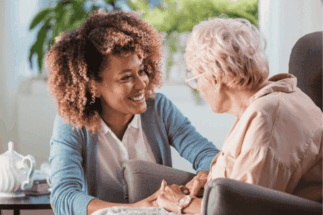 Caregiver providing companionship and supportive care to a senior in a warm, caring environment, ensuring emotional well-being.Caregiver providing companionship and supportive care to a senior in a warm, caring environment, ensuring emotional well-being.